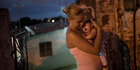 Gleyse Kelly da Silva holds her daughter who was born with microcephaly, outside their house in Brazil. Photo / AP